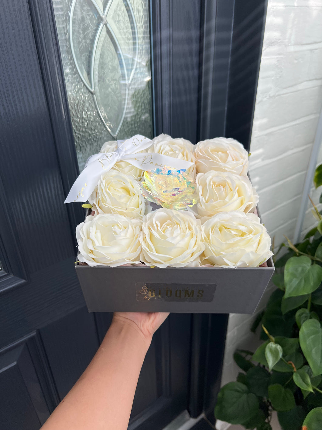 Square grey box with white roses